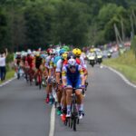 group of cyclists marching on highway