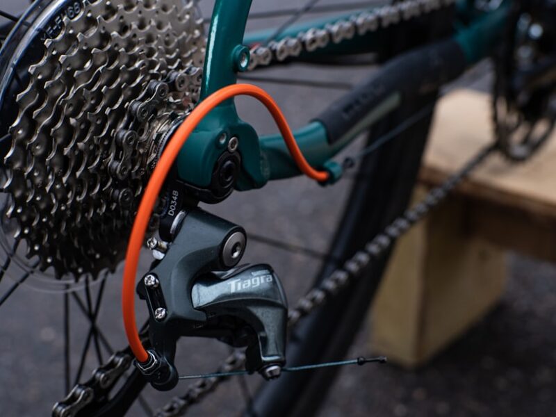 black bicycle wheel with green handle