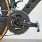 Modern bicycle's black rotor chainring and crankset with chain