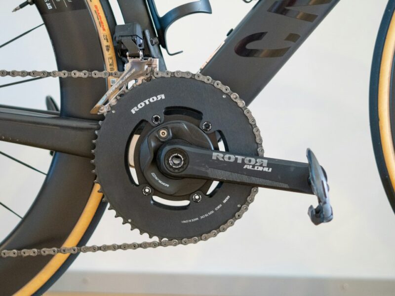 Modern bicycle's black rotor chainring and crankset with chain